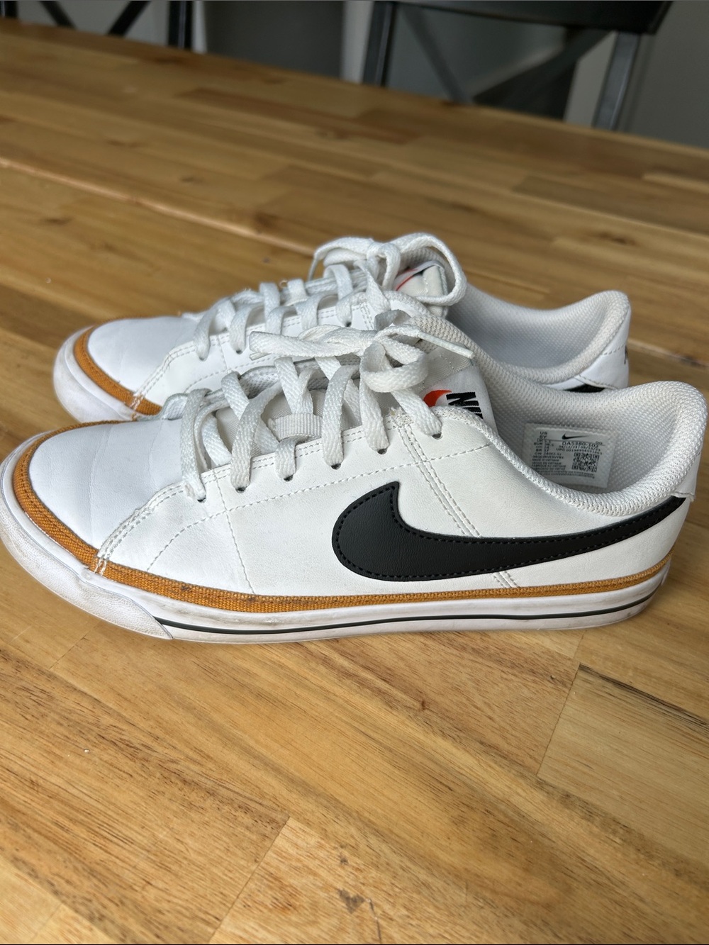 Nike Kid’s White Sneakers with Black Swoosh and Brown Trim